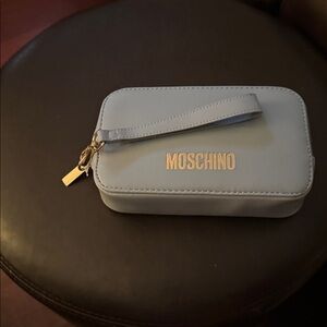 Moschino Baby blue wristlet Bag with Gold Accents.